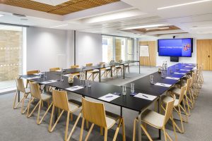 Planning a business meeting. Yusuf Hamied Court set out in board rom style with table and chairs.