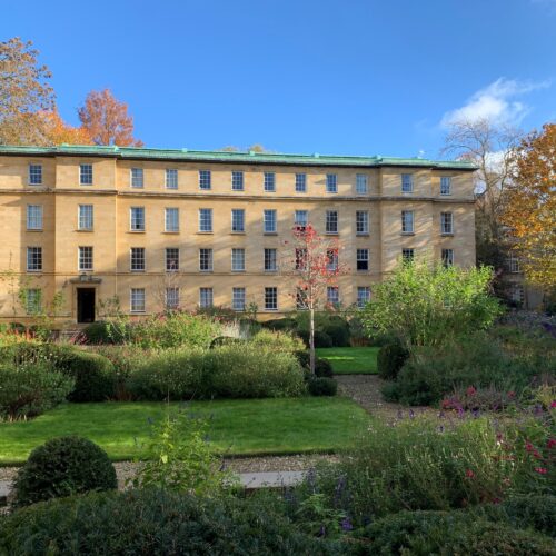 Christ's College Third Court in the Autumn sun with the the leaves turning golden on the trees.