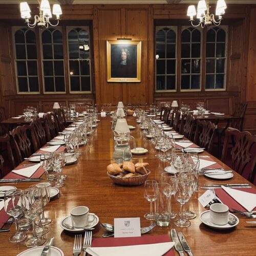 The Old Combination Room at Christ's College, set up for a private dinner at night.
