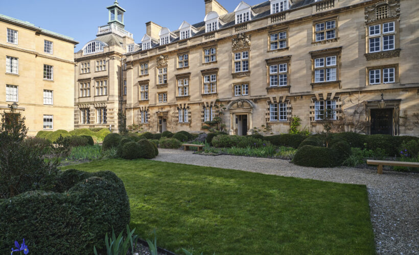 View of Third Court at Christ's College, Cambridge, showcasing traditional collegiate architecture, green lawns, and peaceful surroundings.