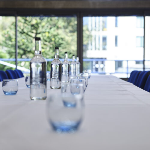 Glasses and water set up for a function at Christ's College.