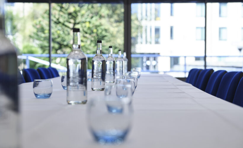 Glasses and water set up for a function at Christ's College.