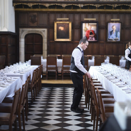 The Great Hall at Christ's College being set up for dinner.