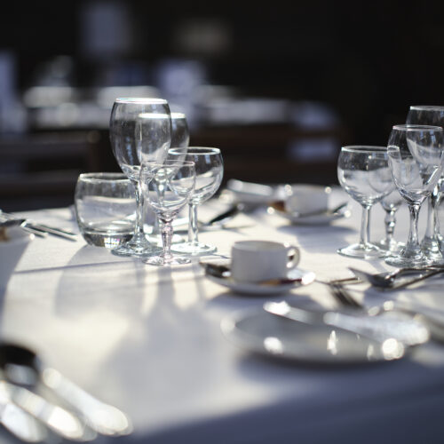Glasses and Cutlery set up in the Great Hall at Christ's College, Cambridge