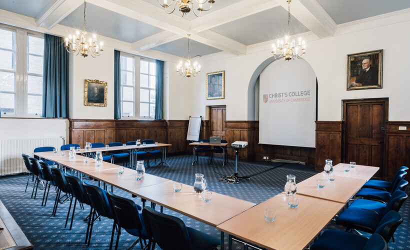 The Lloyd Room at Christ's College, Cambridge set up with a projector. A light airey room ideal for seminars and meetings.