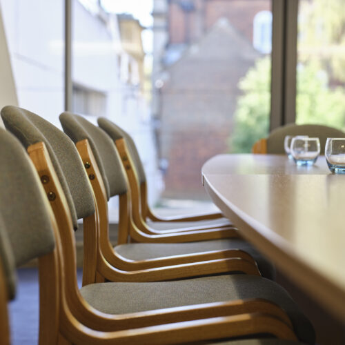 A filler shot of chairs, tables and glasses.