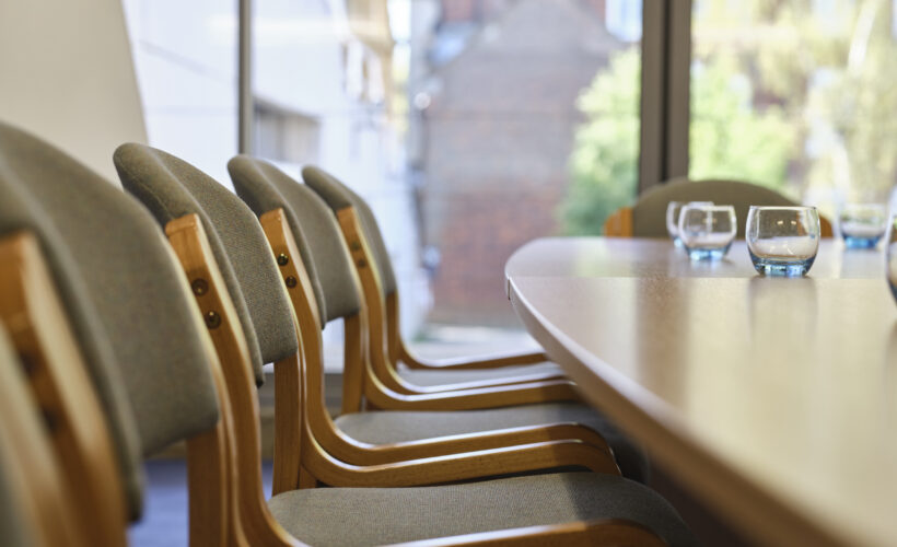 A filler shot of chairs, tables and glasses.