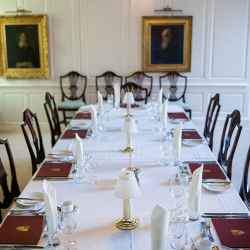 Historic Portrait Room at Christ’s College, Cambridge with ornate framed portraits displayed along the walls and period-style seating in a refined interior.
