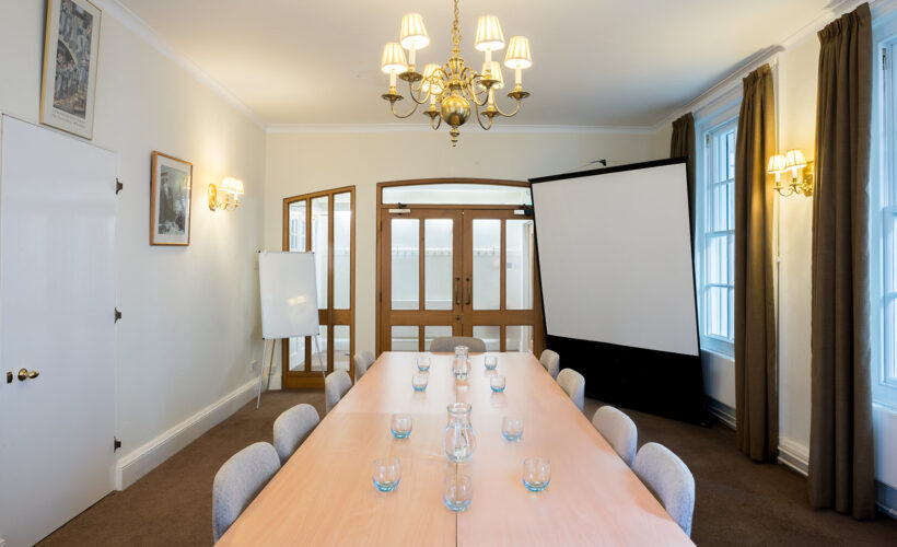 The Sosnow Room at Christ’s College, Cambridge, featuring a light and spacious interior arranged for a small meeting, breakout session, or conference refreshment area.
