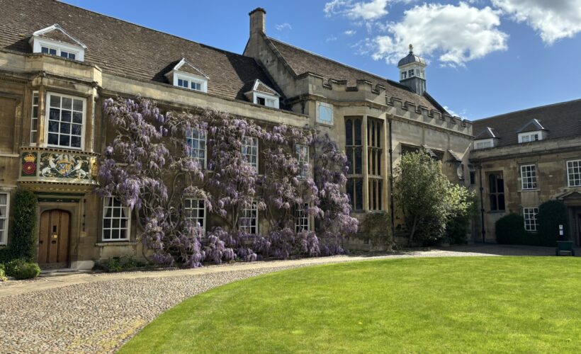 Christ's College First Court in Cambridge in the Spring with beuatiful Wisteria round the windows of the Master's Lodge.