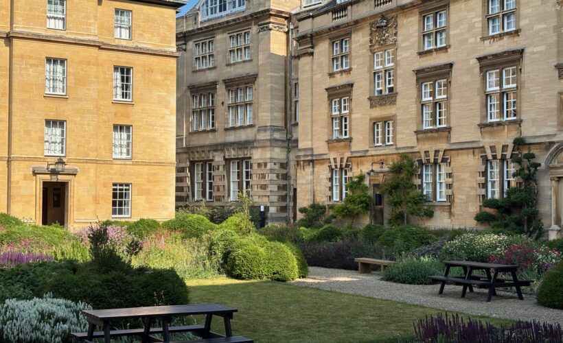 Christ's College Third Court in the sunshine featuring picnic benches. This is a great spot for students to relax in who may be attending a Christ's College Summer School.