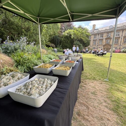 A garden party at Christ's College in the Fellows Garden with a selection of cold salads on offer. Read our conference insights on how to plan a great event.