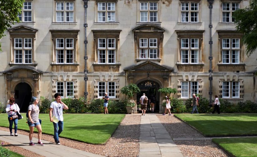 Second Court at Christ’s College, Cambridge, featuring historic stone buildings surrounding a central green lawn in a traditional college courtyard.