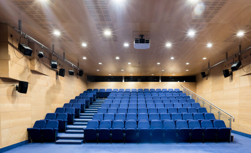 Seats in the Yusuf Hamied lecture theatre at Christ's College. A lecture theatre in Cambridge